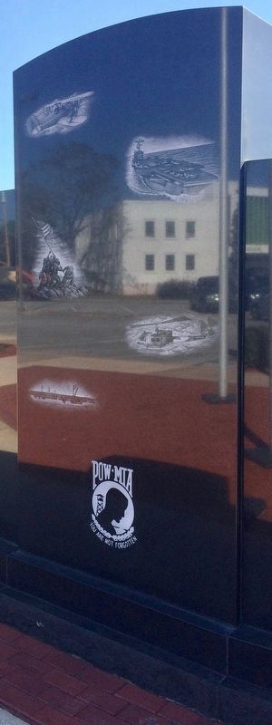 Rear side of Okaloosa County Veterans Memorial showing services & POW/MIA symbol. image. Click for full size.