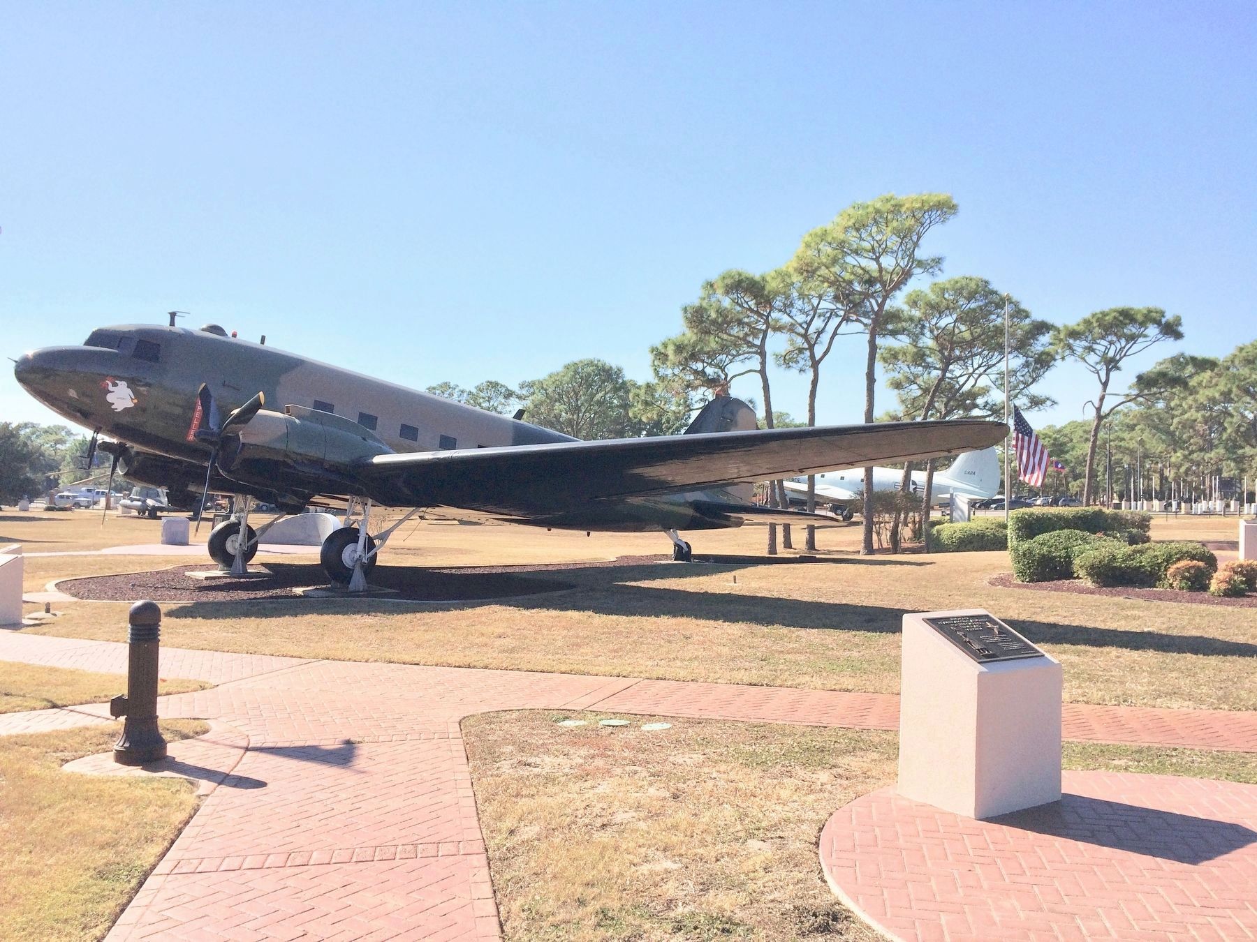 Gold Star Mothers Marker (on right) near AC-47 'Spooky' aircraft. image. Click for full size.