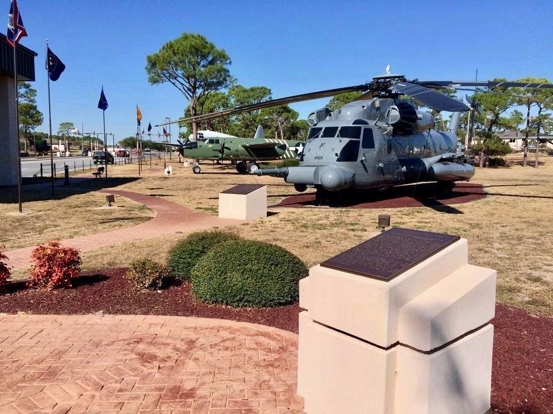 Operation Kingpin Marker (in foreground) between the MH-53 (left) & HH-3 helicopters. image. Click for full size.