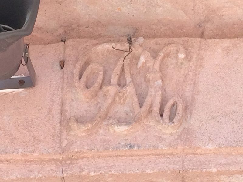 The initials of Tiburcio �ngeles (TA) over the church's front entrance. image. Click for full size.
