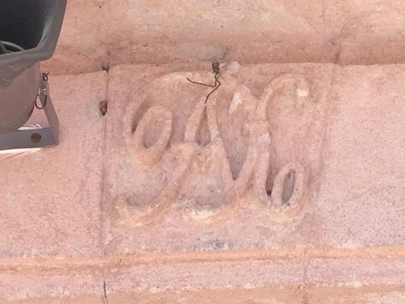 The initials of Tiburcio ngeles (TA) over the church's front entrance. image. Click for full size.