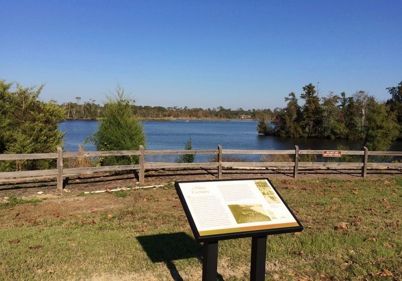 A New Century Marker and Blackwater River (background).. Click for full size. A New Century Marker and Blackwater River (background). image. Click for full size.