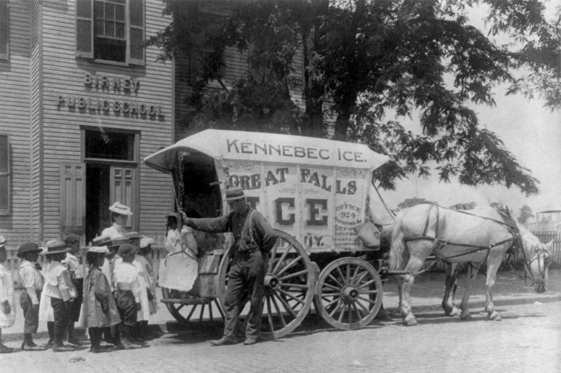 Students learn about the ice cream man in front of the original Birney School 1899. image. Click for full size.