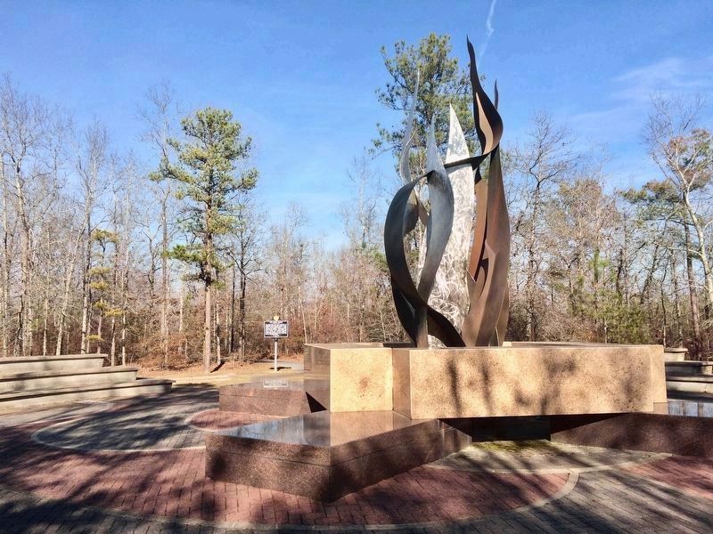 A 21-foot-high steel and bronze sculpture representing the Sacred Fire. image. Click for full size.