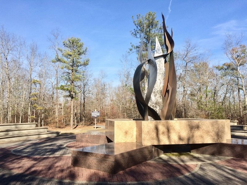 A 21-foot-high steel and bronze sculpture representing the Sacred Fire. image. Click for full size.