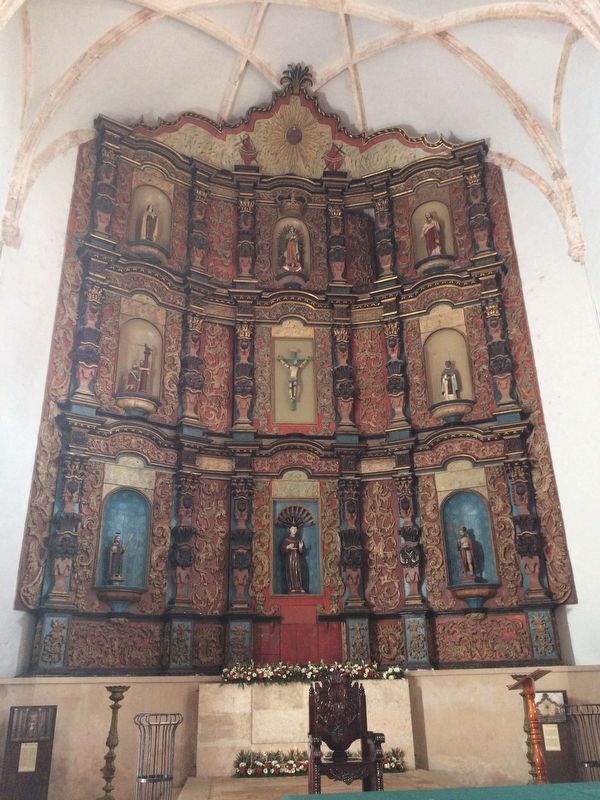 The painted, wooden tableau ("retablo") above the tabernacle and altar.. Click for full size. The painted, wooden tableau ("retablo") above the tabernacle and altar. image. Click for full size.