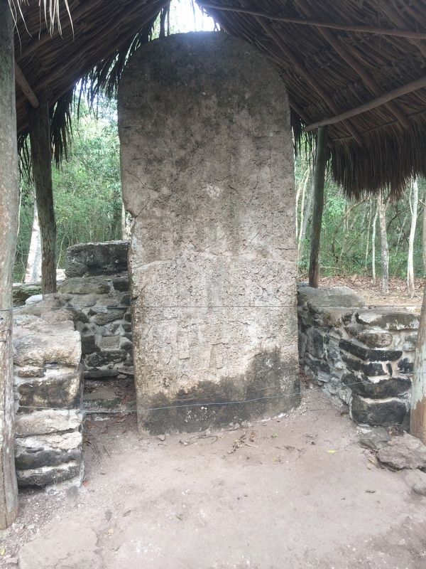 A badly eroded stela near the Paintings Complex. image. Click for full size.