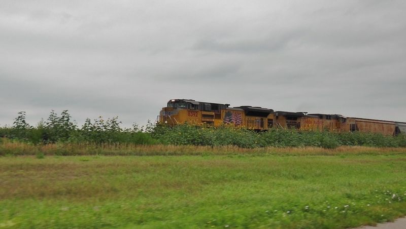 Union Pacific Train passing behind marker. Click for full size. Union Pacific Train passing behind marker image. Click for full size.