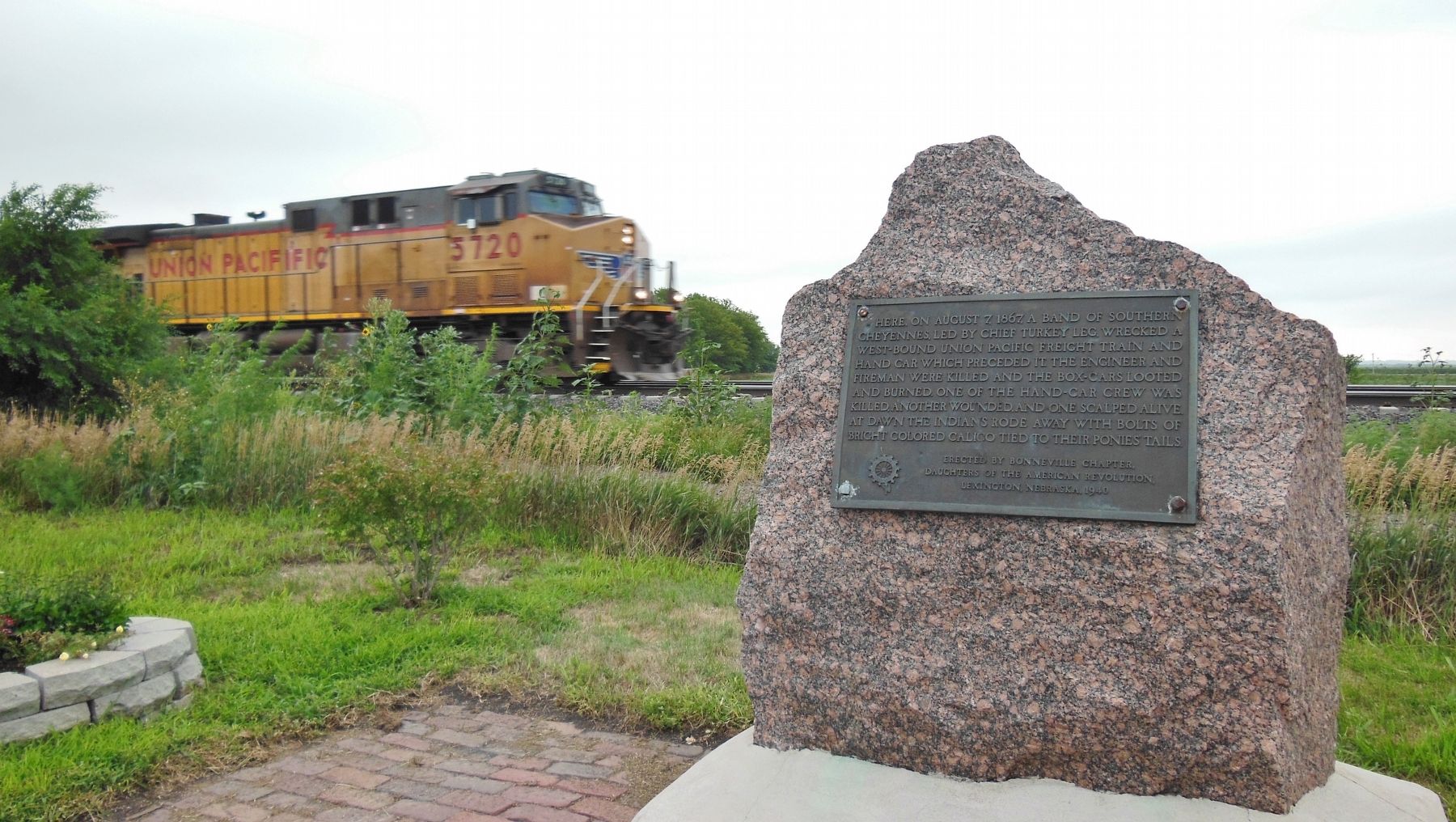 West-bound Union Pacific freight train passing the marker, 146 years later! image. Click for full size.