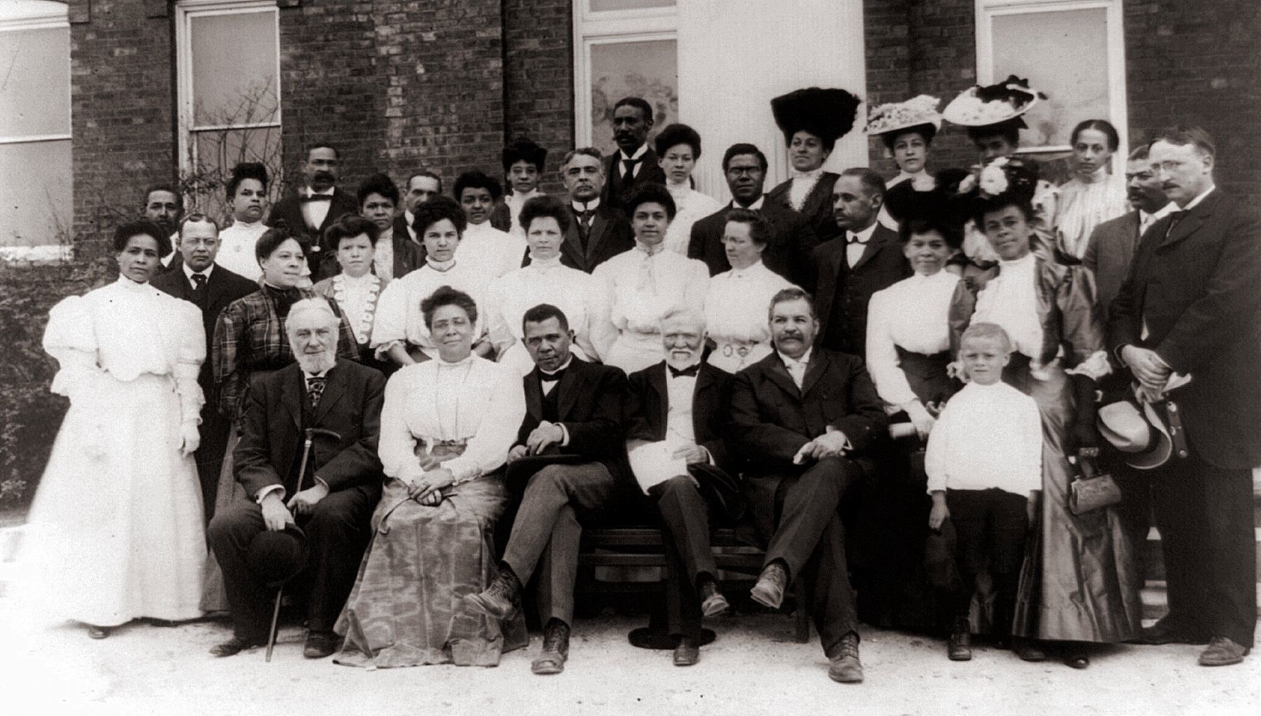 Carnegie with African-American leader Booker T. Washington visiting Tuskegee Institute faculty. image. Click for full size.