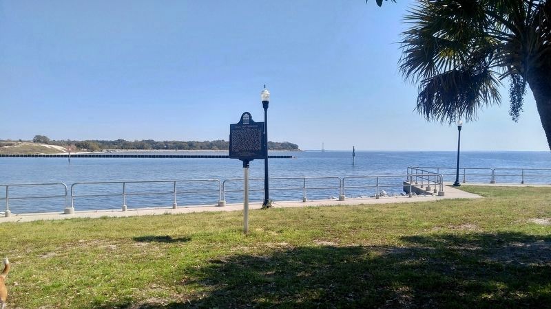 View of marker and Pensacola Bay shipwreck area in background. image. Click for full size.