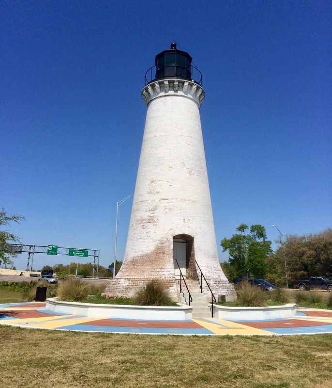 Round Island Lighthouse with U.S. Highway 90 in background. image. Click for full size.