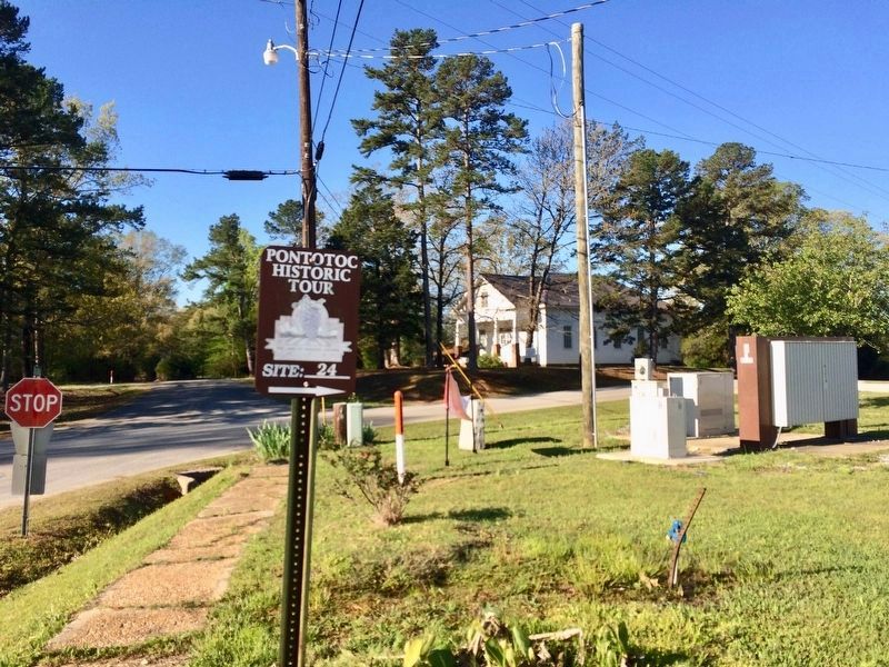 Betty Allen stone (to right of fiber cable marker) along with Pontotoc Historic tour sign. image. Click for full size.