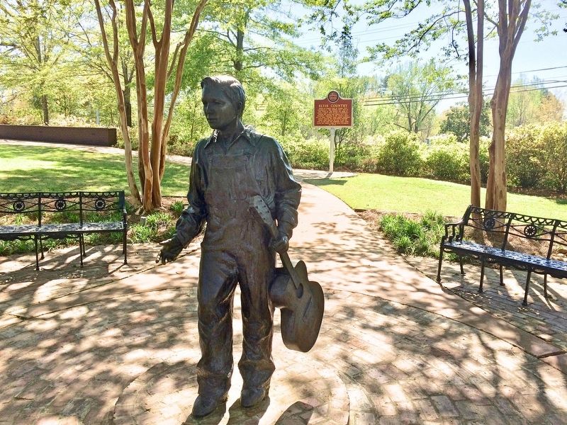 Statue of Elvis at age 13, in front of marker. image. Click for full size.
