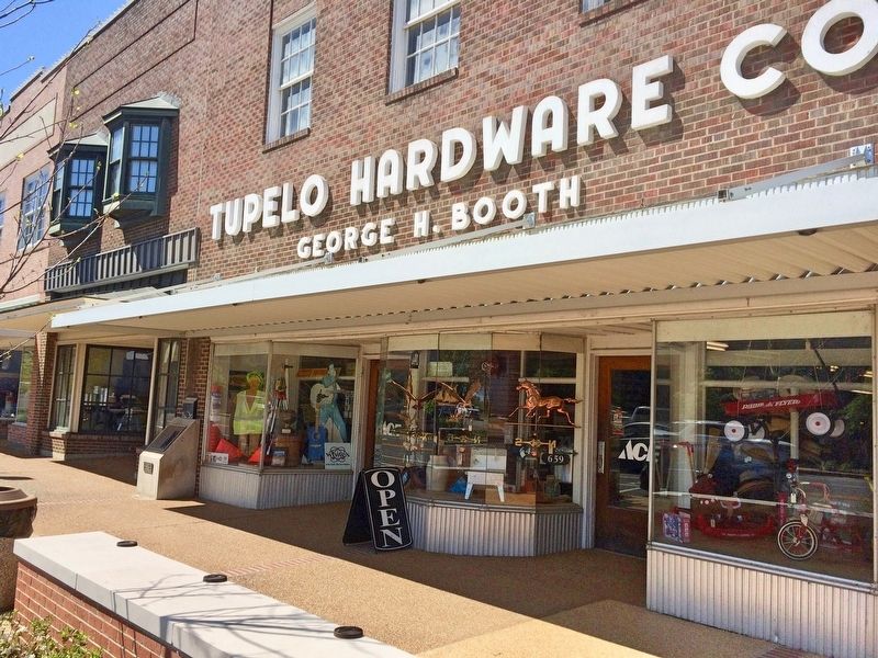Tupelo Hardware Elvis Marker at left end of store. image. Click for full size.