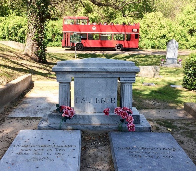 Grave of William Faulkner and his wife, in Oxford Memorial Cemetery, with marker in background. image. Click for full size.