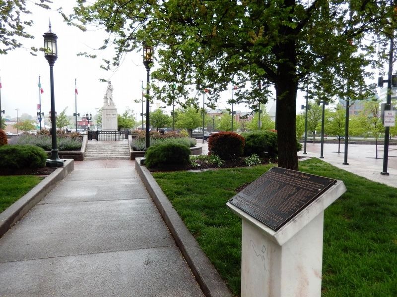 Christopher Columbus Memorial Marker in the background and the Columbus Piazza tablet. image. Click for full size.