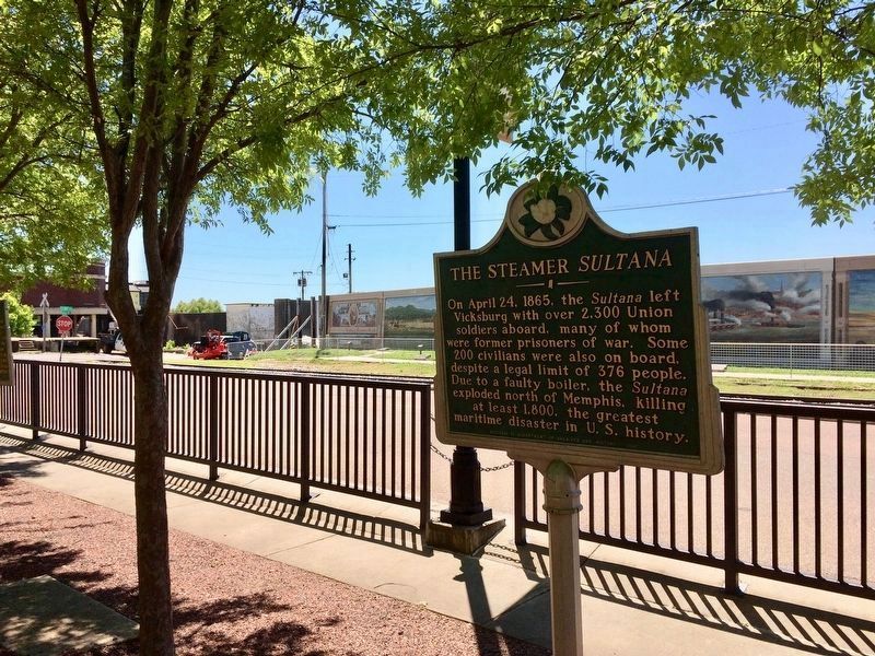 The Steamer <i>Sultana</i> marker along the park fence on Levee Street.. Click for full size. The Steamer <i>Sultana</i> marker along the park fence on Levee Street. image. Click for full size.