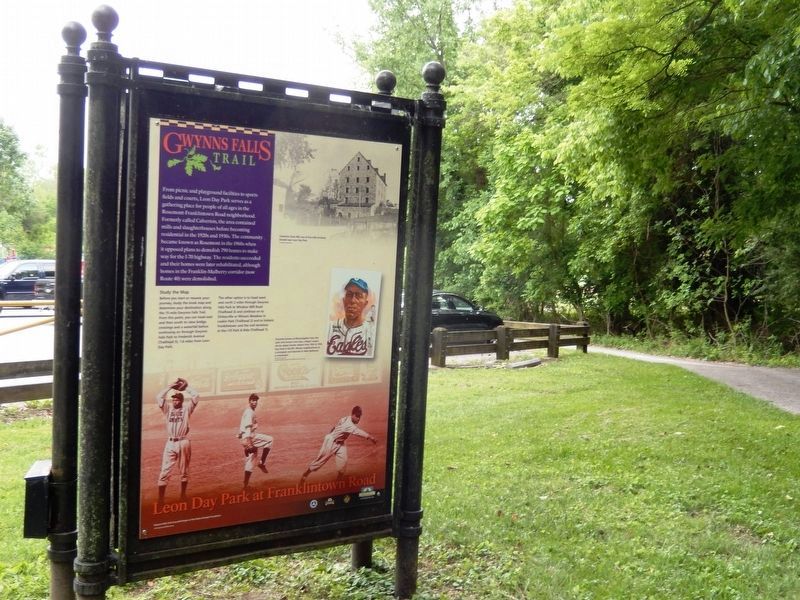Gwynns Falls Trail Marker with parking lot in the background image. Click for full size.