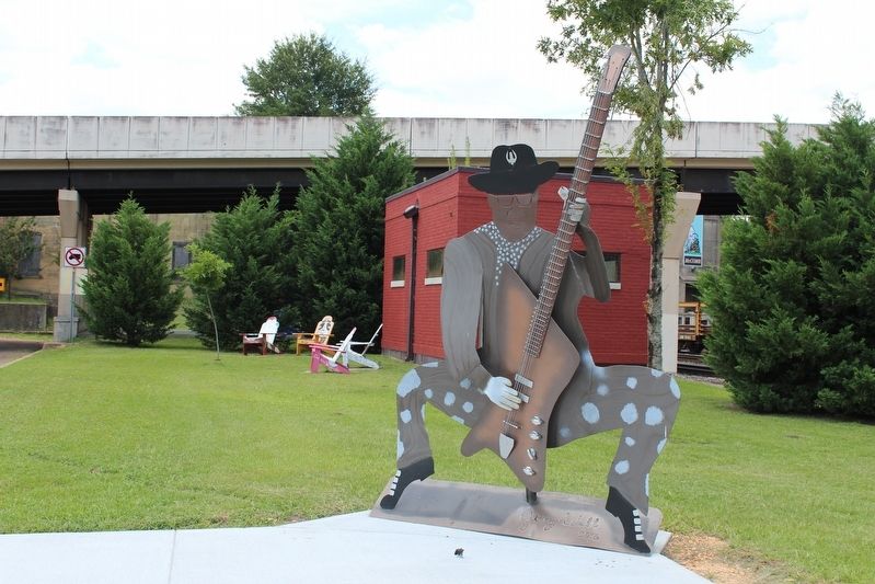 Bo Diddley sculpture near marker. image. Click for full size.