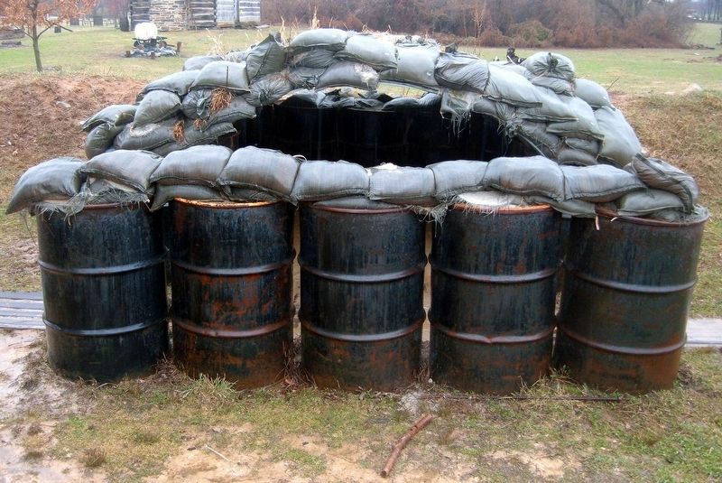 A sandbag and oil drum bunker image. Click for full size.