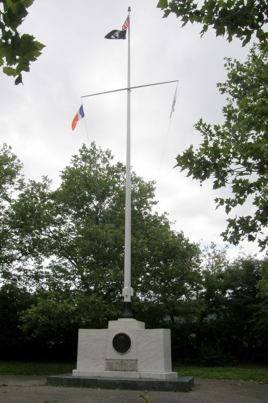 The marker is incorporated into a standard NYC Parks Department flagpole. image. Click for full size.