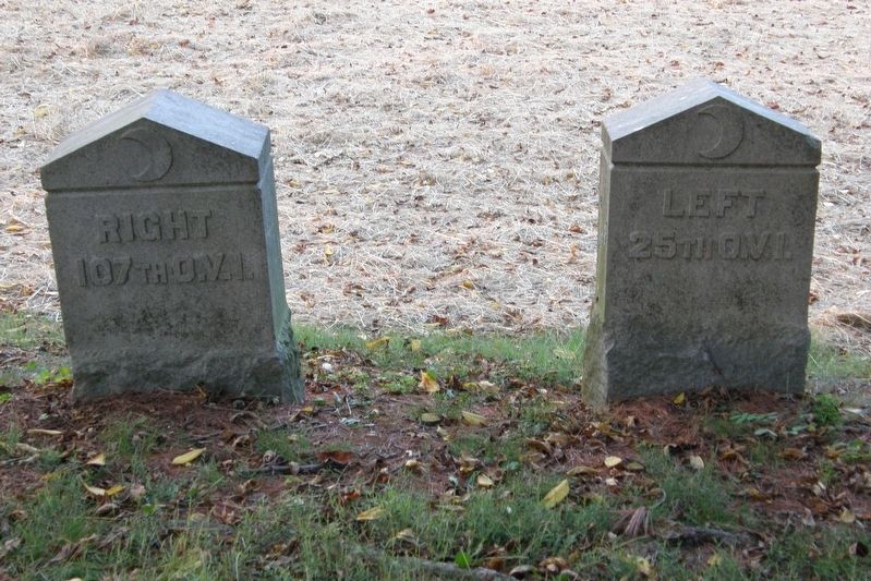 These two flank markers, once hidden behind the house, are now in plain view. image. Click for full size.