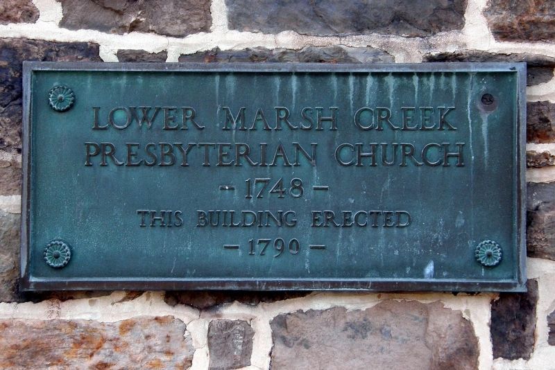 Marker on the wall of the original church building. image. Click for full size.