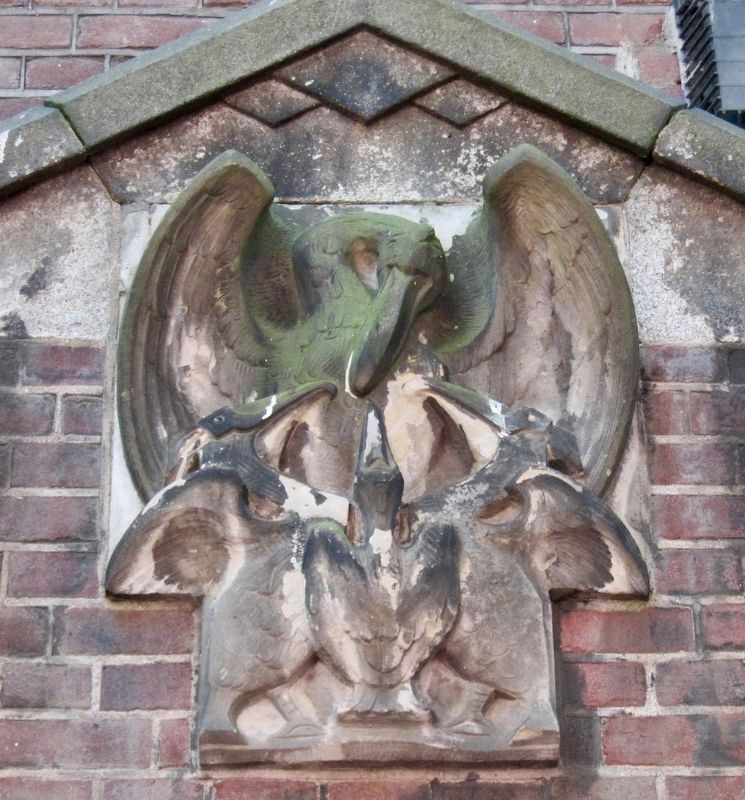 Pelican Feeding Her Young Her Own Blood - Gevelsteen (Gable Stone) Above the Entrance of 12A. Click for full size. Pelican Feeding Her Young Her Own Blood - Gevelsteen (Gable Stone) Above the Entrance of 12A image. Click for full size.