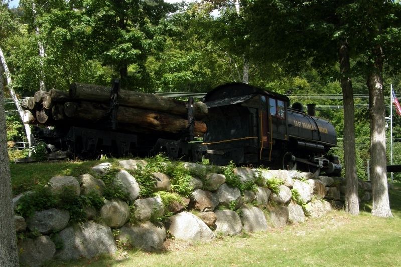 The engine and a log car. image. Click for full size.