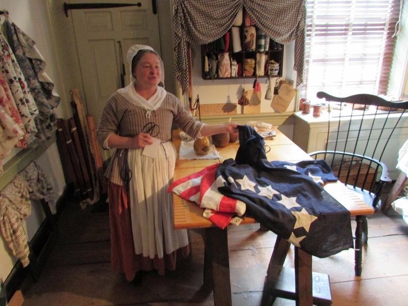 Betsy Ross with her flag image. Click for full size.