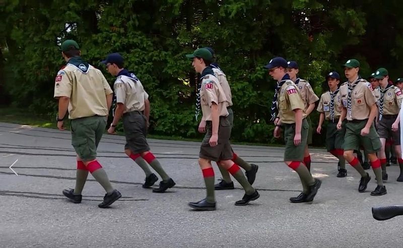 Boy Scouts marching towards barracks image. Click for full size.