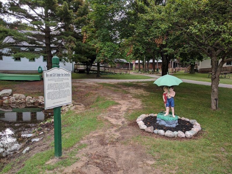 Boy and Girl Under the Umbrella Statue and Marker. Click for full size. Boy and Girl Under the Umbrella Statue and Marker image. Click for full size.