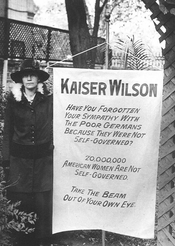 Virginia Arnold holding the Kaiser Wilson banner image. Click for full size.