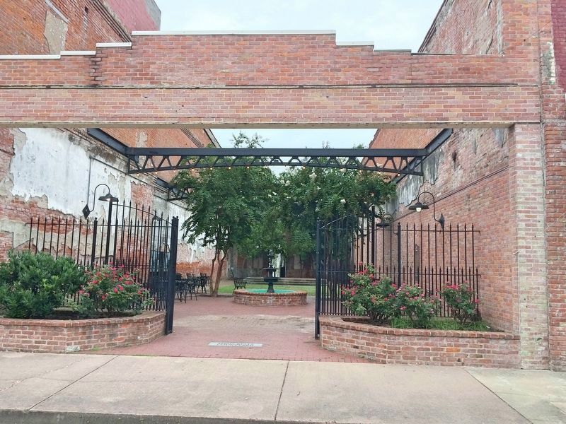 Pocket park, known as the Thad Kelly Courtyard, in the footprint of former building.. Click for full size. Pocket park, known as the Thad Kelly Courtyard, in the footprint of former building. image. Click for full size.
