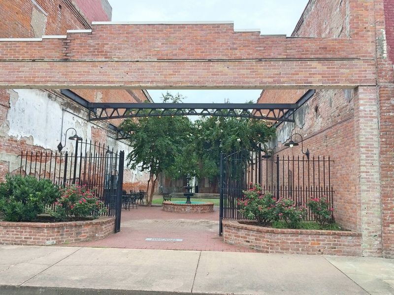Pocket park, known as the Thad Kelly Courtyard, in the footprint of former building.. Click for full size. Pocket park, known as the Thad Kelly Courtyard, in the footprint of former building. image. Click for full size.