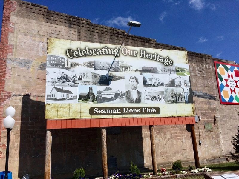 Billboard across street from marker showing town of Seaman's past. image. Click for full size.