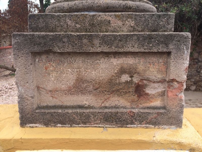 Earlier inscription on the column, now mostly unreadable. image. Click for full size.