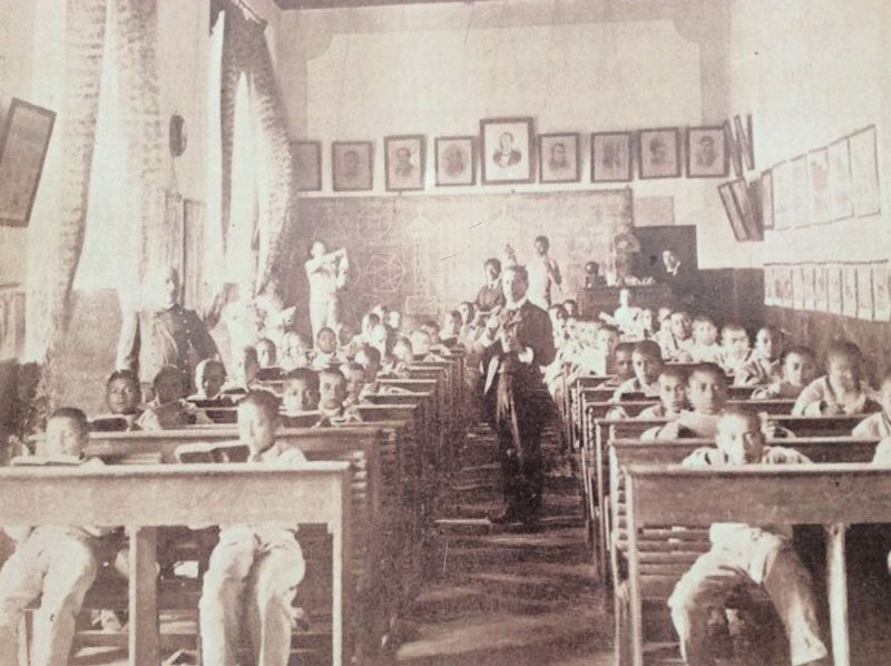 A Model School classroom, taken from the marker. image. Click for full size.