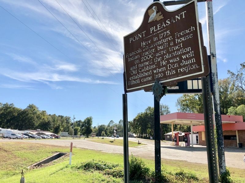 View of marker looking west on US Highway 165 near currently closed gas station. image. Click for full size.