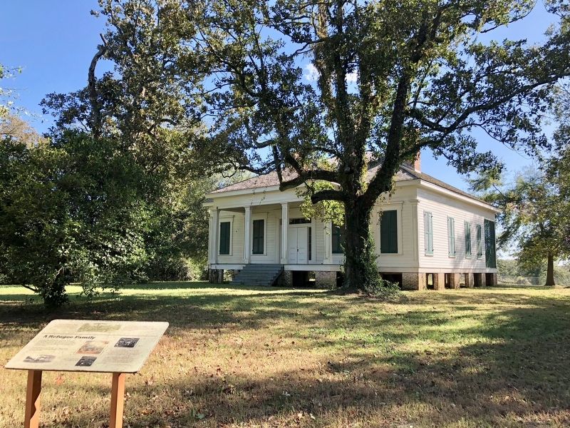 A Refugee Family Marker in front of the Coker House.. Click for full size. A Refugee Family Marker in front of the Coker House. image. Click for full size.