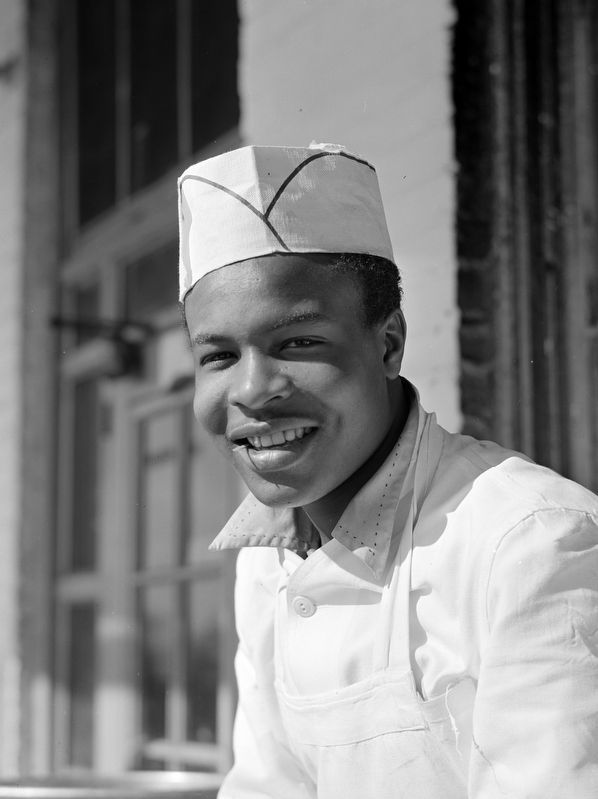Washington, D.C. Cook who works in one of the seafood restaurants in the fish market district image. Click for full size.