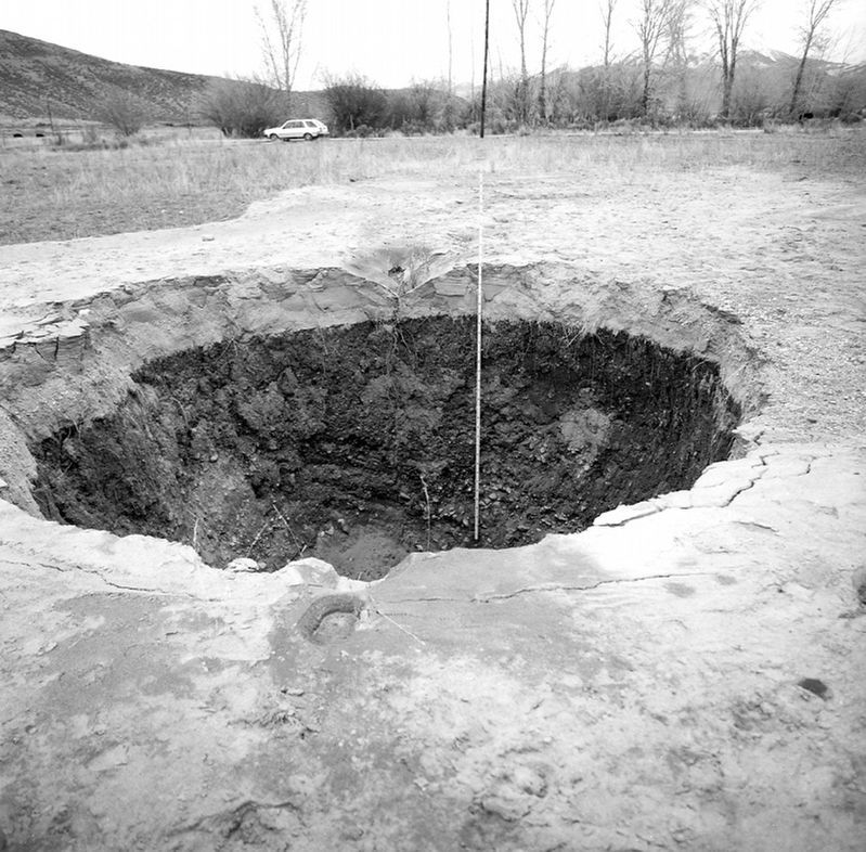 Crater caused by an artesian fountain (sand blow). image. Click for full size.