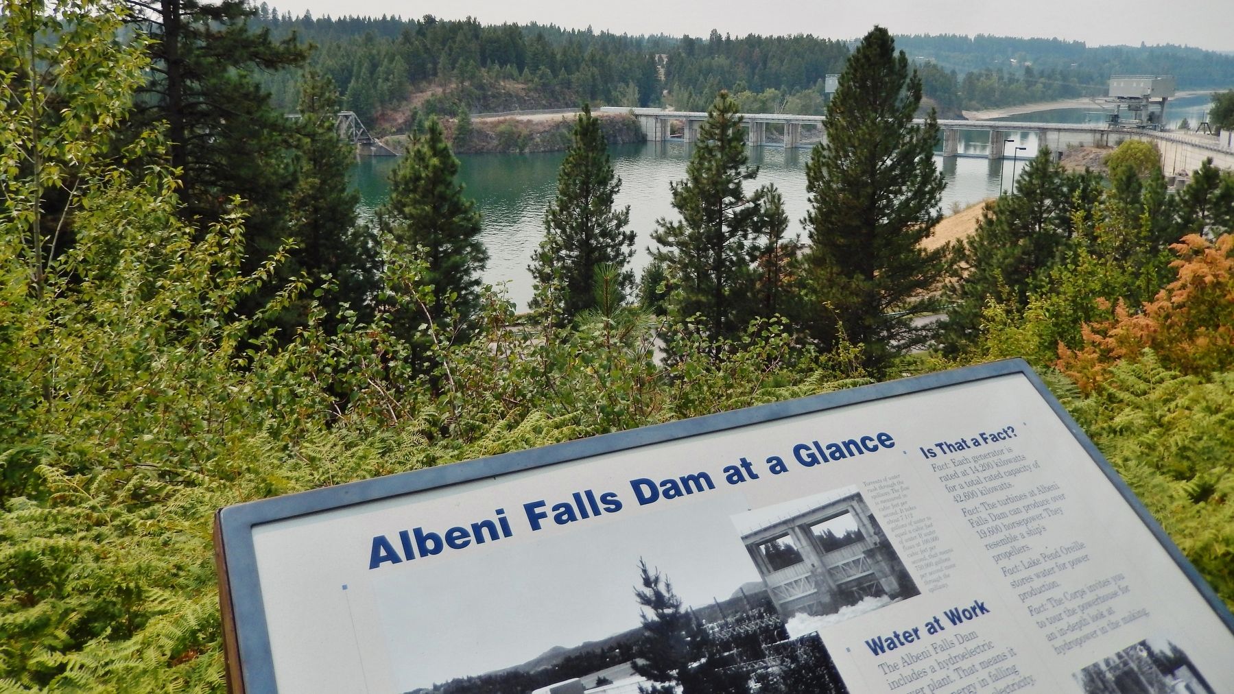 Albeni Falls Dam at a Glance Marker (<i>wide view with dam in background</i>). Click for full size. Albeni Falls Dam at a Glance Marker (<i>wide view with dam in background</i>) image. Click for full size.