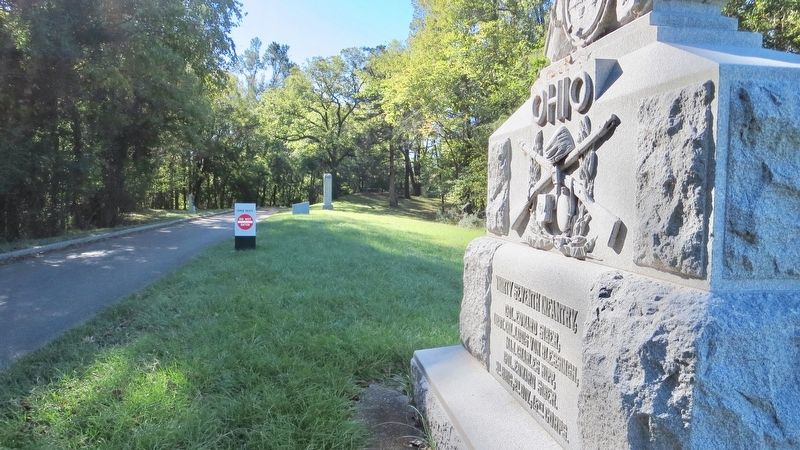 This monument is in far distance on right side of road. image. Click for full size.