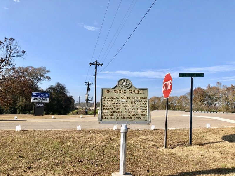 View of marker and church sign at intersection of U.S. 84 and Big Creek Church Road. image. Click for full size.