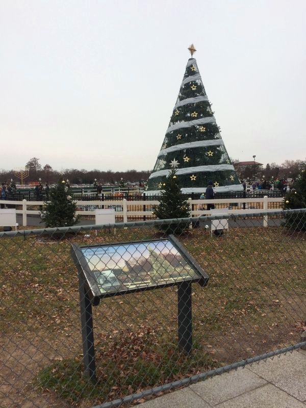 The National Christmas Tree Marker with the National Christmas Tree in the background image. Click for full size.
