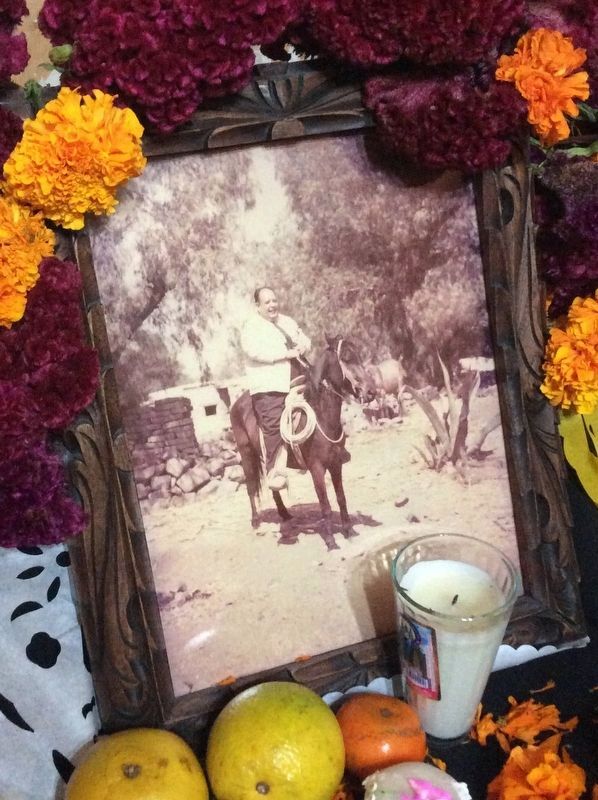 A photo of Professor Eduardo Loarca Castillo riding a horse image. Click for full size.