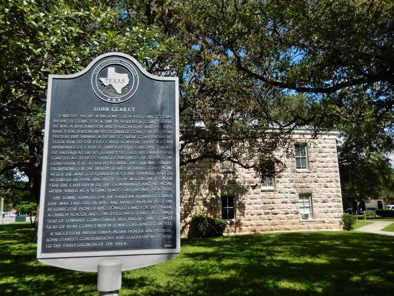 John Leakey Marker (<i>wide view; Real County Courthouse in background</i>). Click for full size. John Leakey Marker (<i>wide view; Real County Courthouse in background</i>) image. Click for full size.