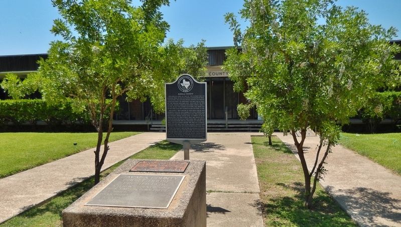 Zavala County Marker (<i>wide view; courthouse in background; 1928 cornerstone in foreground</i>) image. Click for full size.